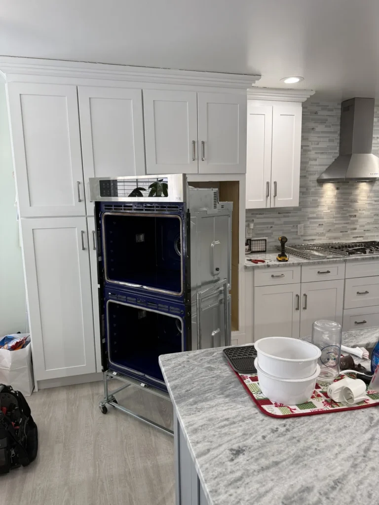 LG double wall oven: Doors off and unit pulled for board access
