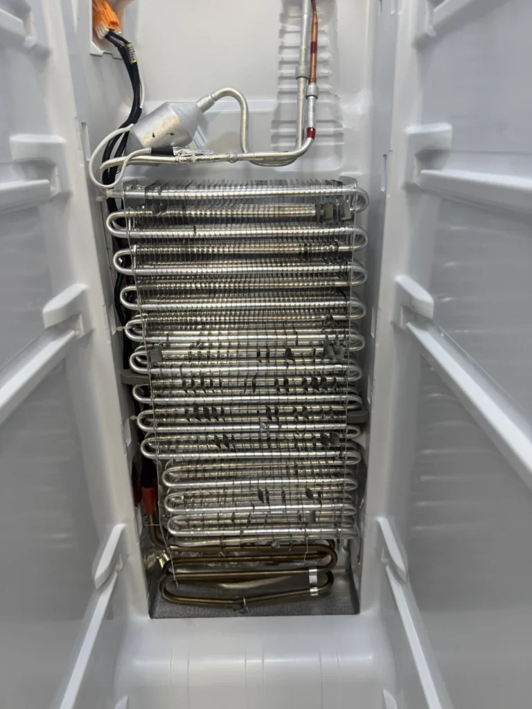Side-by-side evaporator: Coil cleared and defrost heater checked